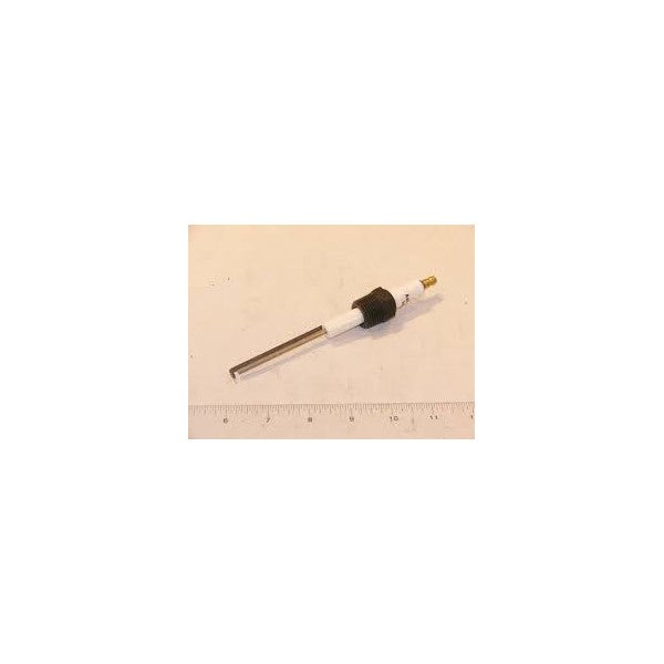 A metal and plastic cylindrical E5-I-2-EI-2 (13581) bujia de ignición con varrilla, with a pointed tip and a black ring near the middle, is placed horizontally on a light surface with a ruler below for scale.